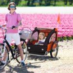 2-Seat Child Bike Trailer for Kids with a Strong Steel Frame, 5-Point Safety Harnesses, & Comfortable Seat, Orange - Image 2