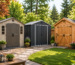 Three outdoor storage sheds made of resin, metal, and wood in a beautifully landscaped backyard.