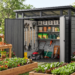 Modern outdoor storage shed with organized shelves, garden tools, lawn equipment, and raised garden beds in a landscaped backyard.