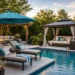 Luxury backyard pool with chaise lounges, a cantilever umbrella, pergola, gazebo, and comfortable outdoor seating.
